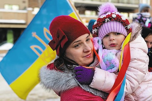 Liudmyla holds Kristina Kardash in front of Brandon City Hall Friday during a rally in support of Ukraine. The country was invaded by Russian forces Thursday. (Chelsea Kemp/The Brandon Sun)