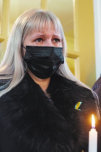 Nadiia Khomenko holds a candle at the Holy Ghost Ukrainian Orthodox Church on Sunday during a prayer service in support of Ukraine. In response to the Russian invasion of the country, the Ukrainian Orthodox Church of Canada has blessed all churches to be active centres of prayer and &#x201c;havens for the storm-tossed&#x201d; to provide solace to communities. See more photos from the service on Page A6. (Chelsea Kemp/The Brandon Sun)