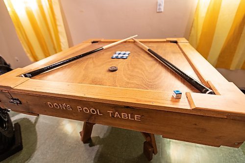 Daniel Crump / Winnipeg Free Press. Adonis Fernandez designed this filipino pool table. The game is played with discs instead of balls. March 2, 2022.