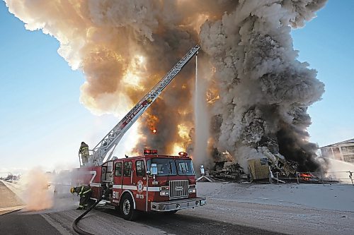 Brandon Sun 17022022

Brandon Fire and Emergency Services members battle a large fire that destroyed an apartment complex under construction on Victoria Avenue and 42nd Street in Brandon on a bitterly cold Thursday morning. Smoke from the blaze could be seen from across the city as it towered up into the clear sky. (Tim Smith/The Brandon Sun)