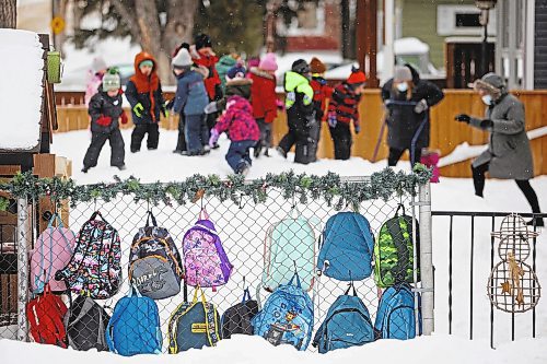 Brandon Sun 01032022

Colourful backpacks hang from the fence at Wee Wisdom Nursery School on 28th Street at Princess Avenue as children play in the snow towards the end of class on Tuesday.   (Tim Smith/The Brandon Sun)