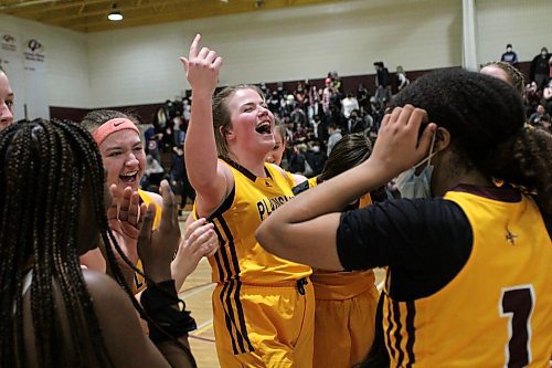 Liz Ball, centre, and the Crocus Plainsmen celebrate their 63-51 win over the Vincent Massey Vikings in Game 2 of the varsity girls city basketball final at Crocus on Tuesday. (Thomas Friesen/The Brandon Sun)