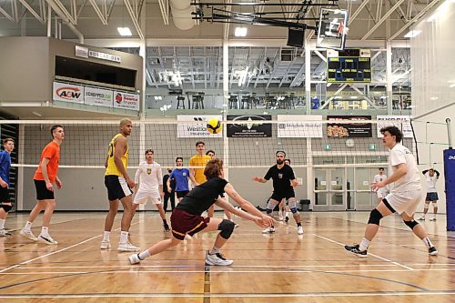 Rylan Metcalf, centre, passes during Brandon University Bobcats men's volleyball practice at the Healthy Living Centre on Monday. The Bobcats are in B.C. for the first round of the Canada West playoffs. (Photos by Thomas Friesen/The Brandon Sun)