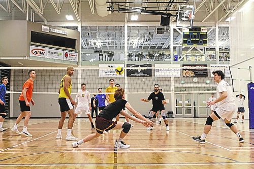 Rylan Metcalf, centre, passes during Brandon University Bobcats men's volleyball practice at the Healthy Living Centre on Monday. (Thomas Friesen/The Brandon Sun)