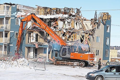 Local demolition crews start to tear down the top floors of Valley View Condominiums, located at 1400 Pacific Ave., on Wednesday morning. The apartment complex endured a massive fire on Sept. 21 that left the entire building uninhabitable. (Kyle Darbyson/The Brandon Sun)
