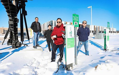Jojo Delos Reyes, RRC Polytech research program manager (centre) with members of his team (from left) Jairuz Agang-ang, Jeongsoo Bae and Bin Yang: the group will lead a study into EV charging needs in the three Prairie provinces. (Winnipeg Free Press)