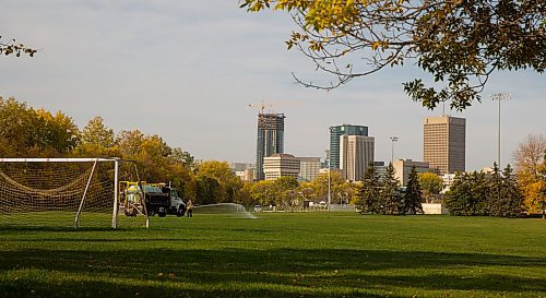 MIKE DEAL / WINNIPEG FREE PRESS

City of Winnipeg Parks employee, Leann Carriere, waters fresh sod at the soccer pitch in Whittier Park early Wednesday morning.

210929 - Wednesday, September 29, 2021.