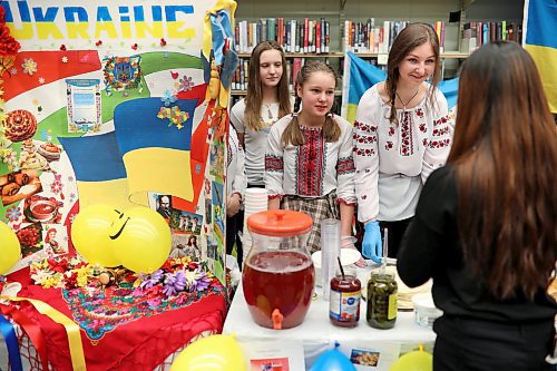 Students representing Ukraine serve traditional dishes during Heritage Days 2018 at Vincent Massey High School. (Tim Smith/The Brandon Sun)