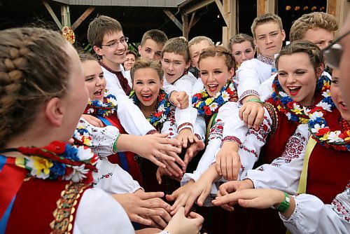 Members of the Selo Ukrainian Dancers from Anola, Man., celebrate after scoring a 99 out of 100 in the amateur talent contest at the 2009 Canada's National Ukrainian Festival just south of Dauphin in 2009. (Tim Smith/Brandon Sun)