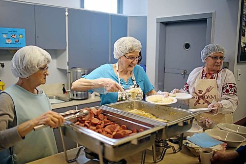 Elsie Makwaychuk, Joann Ellchuk and Elsie Boyko serve perogies to a full house of visitors during the St. Mary's U.C.W.L.C. Perogy Luncheon and Bake Sale at the Ukrainian Reading Hall in Brandon in 2017. (Tim Smith/The Brandon Sun)