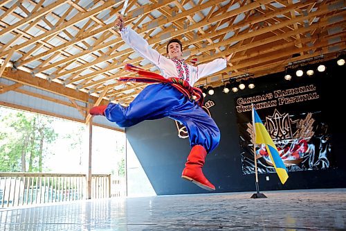 Alex Tarasenko with the Tryzub Ukrainian Dancers from Calgary leaps in the air while performing a heroic solo dance during the talent competition on the opening day of the Canadian National Ukrainian Festival at the Selo Ukraina site just outside Riding Mountain National Park south of Dauphin in 2015. (Tim Smith/Brandon Sun)