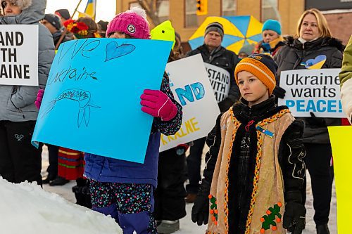 Community members gather for the Stand with Ukraine rally in front of Dauphin City Hall Wednesday.(Chelsea Kemp/The Brandon Sun)
