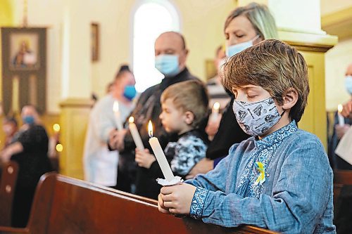 Victor Samotiy, 7, attends the Holy Ghost Ukrainian Orthodox Church prayer service in support of Ukraine Sunday. In response to the Russian invasion of the country the Ukrainian Orthodox Church of Canada has blessed all churches to be active centres of prayer and “havens for the storm-tossed” to provide solace to communities. (Chelsea Kemp/The Brandon Sun)