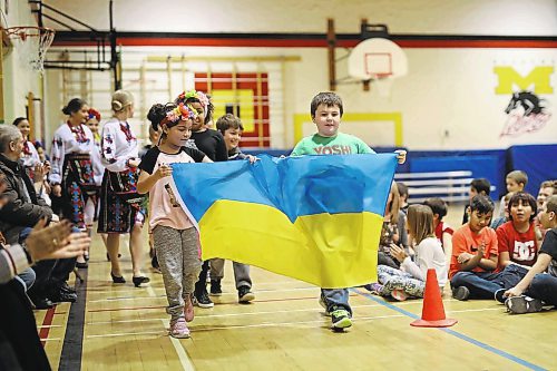 Brandon Sun 07022018

Children from Meadows School representing the Ukraine parade into the gymnasium during the opening ceremonies for the 5th Annual Culture Days at the school on Wednesday. Culture Days continues today with ten pavilions representing different countries around the world set up in classrooms throughout the school.  (Tim Smith/The Brandon Sun)