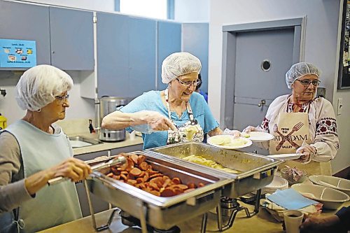 Brandon Sun 01042017

Elsie Makwaychuk, Joann Ellchuk and Elsie Boyko serve up perogies to a full house of visitors during the St. Mary's U.C.W.L.C. Perogy Luncheon and Bake Sale at the Ukrainian Reading Hall in Brandon on Saturday. (Tim Smith/The Brandon Sun)