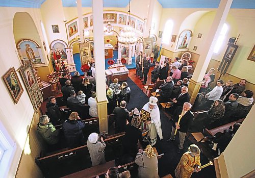 Brandon Sun Father Michael Skrumeda presided over the Christmas Mass held at the Ukrainian Orthodox Church of the Holy Ghost on Wednesday morning marking the Orthodox Christmas on the Julian calendar. (Bruce Bumstead/Brandon Sun)