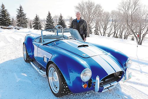 Gord Chester poses for a photo with his replica Shelby Cobra outside his home on Thursday morning. Chester told the Sun that he had ambitions of owning a Cobra since his youth and opted to build his own with a roadster kit due to the rarity of this famous British sports car. (Photos by Kyle Darbyson/The Brandon Sun)