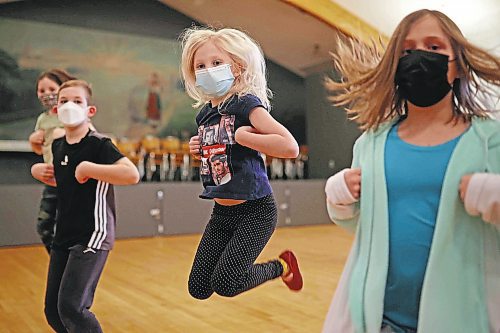 02032022
Ruby Synyshyn leaps while performing with other members of the juniors 8-9 group during dance class with the Brandon Troyanda School of Ukrainian Dance at the Ukrainian National Hall in Brandon on Thursday evening.  (Tim Smith/The Brandon Sun)