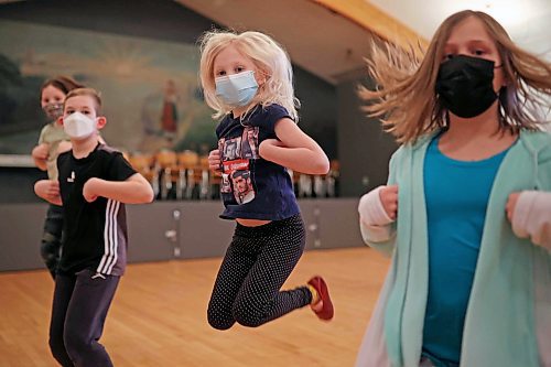 Ruby Synyshyn leaps while performing with other members of the juniors 8-9 group during dance class with the Brandon Troyanda School of Ukrainian Dance at the Ukrainian National Hall Thursday evening. (Tim Smith/The Brandon Sun)