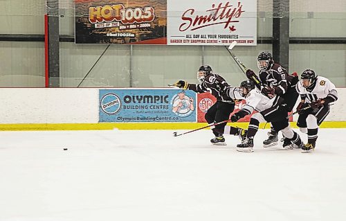 JESSICA LEE / WINNIPEG FREE PRESS



Players race for the puck during a game with the Westwood Warriors and St. Paul’s Crusaders on March 3, 2022.



Reporter: Mike S.