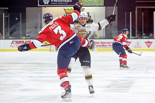 Jesiah Bennett of the Brandon Wheat Kings knocks Chase Pauls of the Lethbridge Hurricanes off his feet during WHL action at Westoba Place on Friday evening. 
(Tim Smith/The Brandon Sun)