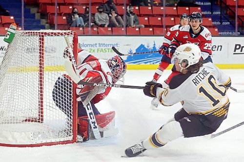 Nolan Ritchie of the Brandon Wheat Kings rifles the puck past goalie Bryan Thomson of the Lethbridge Hurricanes for a goal during the first period of play. 
(Tim Smith/The Brandon Sun)