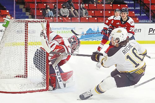 04032022
Nolan Ritchie #10 of the Brandon Wheat Kings rifles the puck past goalie Bryan Thomson #30 of the Lethbridge Hurricanes for a goal during WHL action at Westoba Place on Friday evening. 
(Tim Smith/The Brandon Sun)
