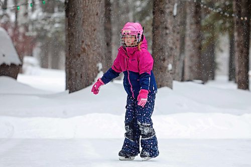 Rhea Majcher, 8, of Winnipeg, skates on the rink in Wasagaming with family on a snowy Friday afternoon.   (Tim Smith/The Brandon Sun)