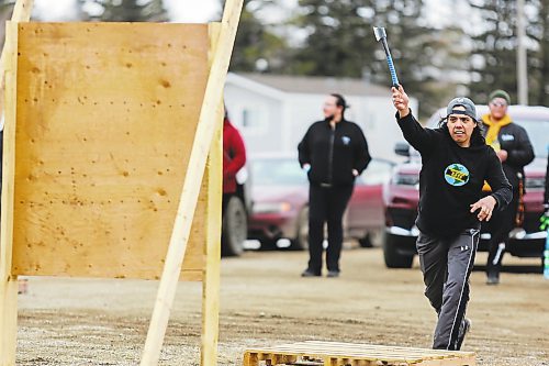 Jonathan Courchene competes in the mens&#x560;hatchet throwing contest during the Wipazoka Wakpa Winter Culture Camp Saturday in Sioux Valley Dakota Nation. (Chelsea Kemp/The Brandon Sun)