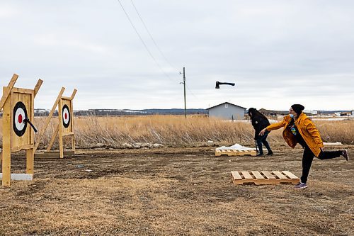 Adele Sinclair throws her axe during the women's hatchet-throwing contest at the Wipazoka Wakpa Winter Culture Camp earlier this month in Sioux Valley Dakota Nation. (Chelsea Kemp/The Brandon Sun)