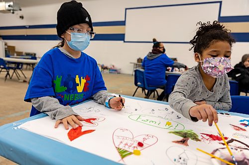 Aislyn Chaske (left), 7, and Milan Wombdiska, 6, draw in Veterans Hall at the Wipazoka Wakpa Winter Culture Camp earlier this month in Sioux Valley Dakota Nation. (Chelsea Kemp/The Brandon Sun)