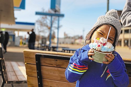 Maci Martin, 4, devours a treat at the Velvet Dip Thursday. A mix of sun and clouds are expected over the weekend with a reported high of 8C and low of -4C. (Chelsea Kemp/The Brandon Sun)