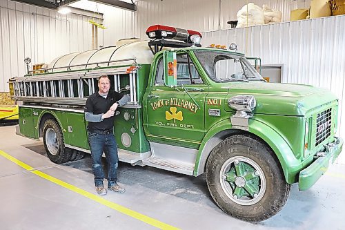 Deputy fire chief Sean Phillips poses for a photo next to a modified 1967 GMC 960 truck on Wednesday evening. The vehicle has been a part of the Killarney-Turtle Mountain Fire Department&#x2019;s fleet for over 50 years and is facing retirement in the not-too-distant future. (Kyle Darbyson/The Brandon Sun)