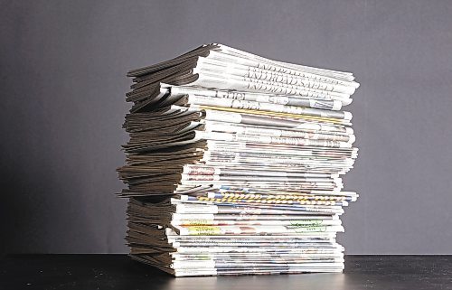 Winnipeg Free Press newspaper stack.



papers



pile



bundle