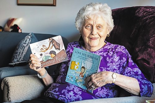 IODC book bag co-ordinator and chapter vice-president Lorna Cowan holds the books &#x493;weetest Kulu&#x4e0;and &#x48c;ove You Forever&#x4e0;in her home Friday.  (Chelsea Kemp/The Brandon Sun)