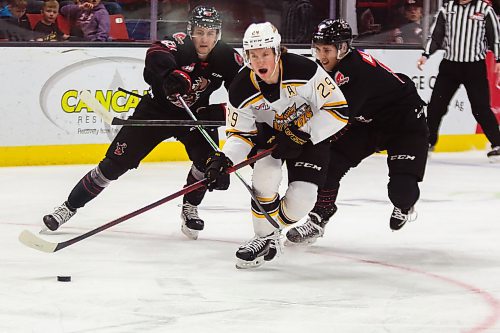 Brandon Wheat King Nate Danielson rushes the net trailed by Moose Jaw Warriors Cole Jordan, left, and Eric Alarie in a Western Hockey League game Saturday at Westoba Place. (Chelsea Kemp/The Brandon Sun)