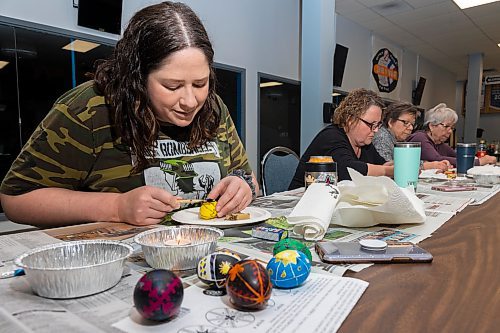 Adri Lee adds a second layer of bee&#x573; wax to decorate her egg during a pysanky workshop Saturday at the Souris-Glenwood Memorial Complex. (Chelsea Kemp/The Brandon Sun)
