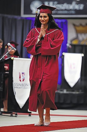 Brandon Sun 03062022

Baking Foundations Certificate graduate Ravneet Kaur puts her hands together while walking up to receive her certificate during Assiniboine Community College&#x2019;s 2022 graduation ceremony at Westoba Place on Friday. 

(Tim Smith/The Brandon Sun)