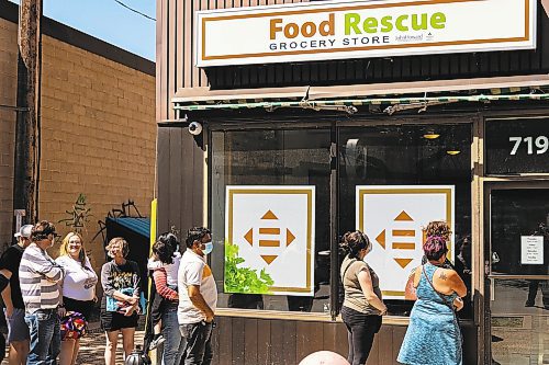 Customers line up outside Brandon&#x2019;s Food Rescue Store Friday. (Chelsea Kemp/The Brandon Sun)