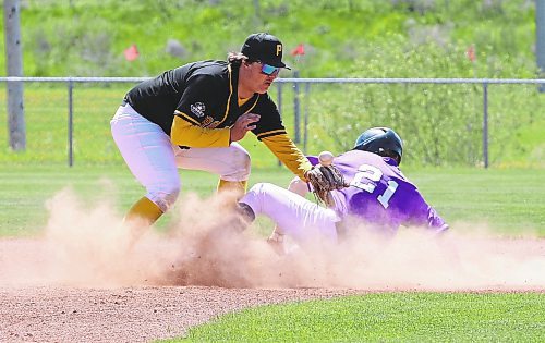 Portage Trojans second baseman Chad Melnic (20) tries to get a handle on a bouncing ball, which briefly sat on top of his glove, as Vincent Massey Vikings baserunner Jayce Thompson (21) slides safely to the bag during quarterfinal action at the high school provincial baseball championship at Sumner Field on Friday afternoon. Portage won 19-9 in a game that ended after five innings due to the mercy rule. (Perry Bergson/The Brandon Sun)