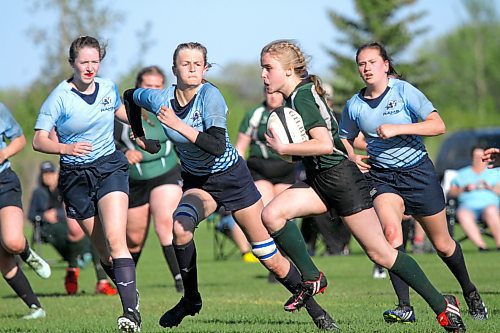 Rivers Rams Payton McNish, second from left, chases down Dauphin Clippers Rhoda Evans during the Westman High School Rugby girls final in Rivers on Friday. Rivers won 20-7. (Photos by Thomas Friesen/The Brandon Sun)