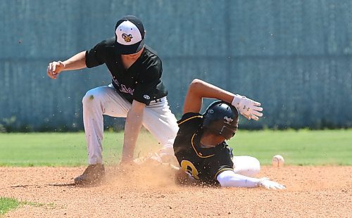 Garden City Fighting Gophers base runner Jordan Armstrong (8) slides safely into second for a stolen base as Stonewall Rams shortstop Bryce Meyers (2) tries to corral a bouncing ball during the provincial high school baseball final at Brandon&#x2019;s Andrews Field on Saturday. (Perry Bergson/The Brandon Sun)