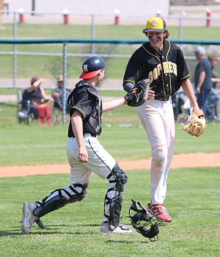 Garden City Fighting Gophers pitcher Nixon Carriere (34) and catcher Colson Smith (19) celebrate after they beat the Stonewall Rams in the provincial high school baseball final at Brandon&#x2019;s Andrews Field on Saturday. (Perry Bergson/The Brandon Sun)