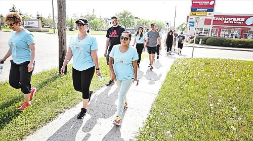 About 20 people, including staff at the Victoria Avenue East Shoppers Drug Mart and a few friends, set out on the annual Shoppers Drug Mart Run for Women for The Mood Disorders Association of Manitoba on Saturday. The Brandon edition was a five-kilometre run or walk that headed east and did a loop back to the store. Every participant made a donation, and staff at the Shoppers fundraised for the cause. (Karen McKinley/The Brandon Sun)