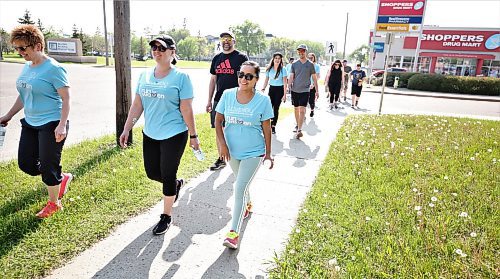 About 20 people, including staff at the Victoria Avenue East Shoppers Drug Mart and a few friends, set out on the annual Shoppers Drug Mart Run for Women for The Mood Disorders Association of Manitoba on Saturday. The Brandon edition was a five-kilometre run or walk that headed east and did a loop back to the store. Every participant made a donation, and staff at the Shoppers fundraised for the cause. (Karen McKinley/The Brandon Sun)