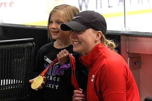 Canadian gold medallist Ashton Bell of Deloraine poses for a picture with seven-year-old Monroe White at the Fierce Female Hockey Camp at J&G Homes Arena on Saturday. (Perry Bergson/The Brandon Sun)
