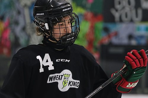 Quinn Parker checks his stick during an intrasquad game at Brandon Wheat Kings prospects camp last month. (Perry Bergson/The Brandon Sun)