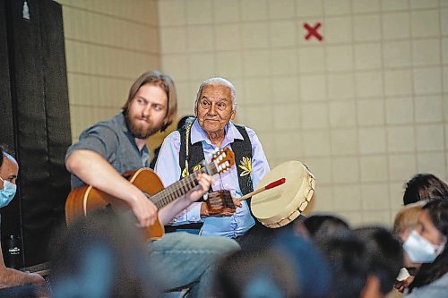 ETHAN CAIRNS / WINNIPEG FREE PRESS

Students of A. E. Wright School to rehearse a cree musical with Elder Winston who is beating a drum, and music teacher Jordan Laidlaw playing guitar in the gymnasium midday in Winnipeg, Manitoba on Monday June 6, 2022.