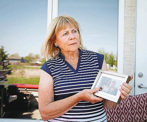 JESSICA LEE / WINNIPEG FREE PRESS



Eleanor Kotelo, mother of Kim Kotelo, a young nurse who died infected with COVID, poses for a photo at her home on June 7, 2022, holding a photo of Kim and Kim’s grandmother.



Reporter: Kevin Rollason