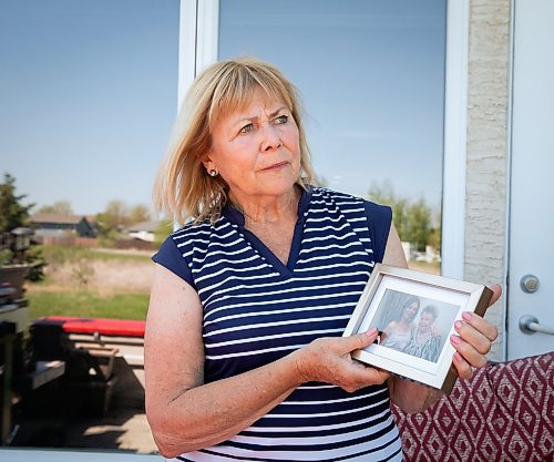 JESSICA LEE / WINNIPEG FREE PRESS



Eleanor Kotelo, mother of Kim Kotelo, a young nurse who died infected with COVID, poses for a photo at her home on June 7, 2022, holding a photo of Kim and Kim&#x2019;s grandmother.



Reporter: Kevin Rollason